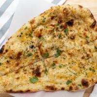 Garlic & Basil Naan · Bread topped with onions, cilantro & spices