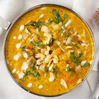 Vegetable Korma · Mixed vegetable curry cooked with Indian spices, cream & nuts.