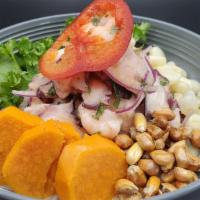 Ceviche Mixto · Gluten free. Fresh seafood marinated in tiger milk, accompanied with sweet potato, white cor...