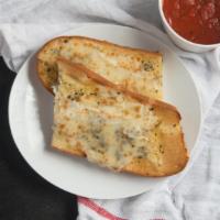 Cheese Bread · Whole. Pizza dough with Mozzarella, Feta and Parmesan cheese with a side of our homemade mar...
