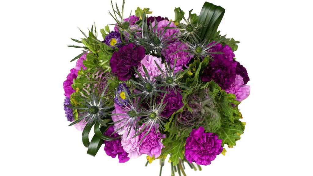 Tickle Me Purple · PACKAGE DETAILS - This bouquet of flowers combines the elegant shades of purple matsumoto and purple carnations with blue thistle. Meanwhile, touches of ornamental kale and lily grass make this the purple and green bouquet of your dreams.

HOW IT SHIPS - Fresh-cut flowers are boxed, secured and go into 