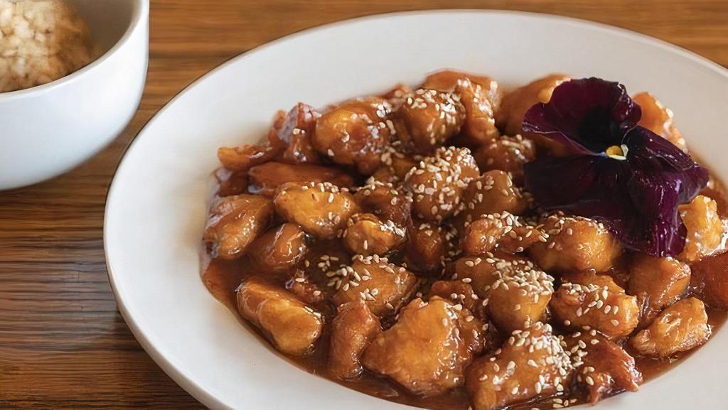 Sesame Chicken · White meat chicken chunk lightly battered and fried, then drizzled over our chef’s spicy sauce with a hint of sweetness. Served with white rice.