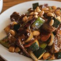 Kung Pao Beef · Sliced tender beef sauteed with chili pepper, zucchini, white onions, carrots, and roasted p...