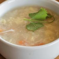 Egg Flower Soup · Wispy beaten eggs in a flavorful chicken broth with peas and carrots. Made with chicken broth.