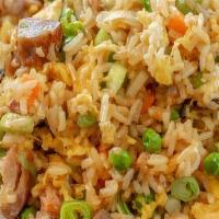 Pork Fried Rice · Authentic fried rice cooked with egg, peas and carrots, green onions and pork