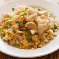 Chicken Fried Rice · Authentic fried rice cooked with egg, peas and carrots, green onions and chicken