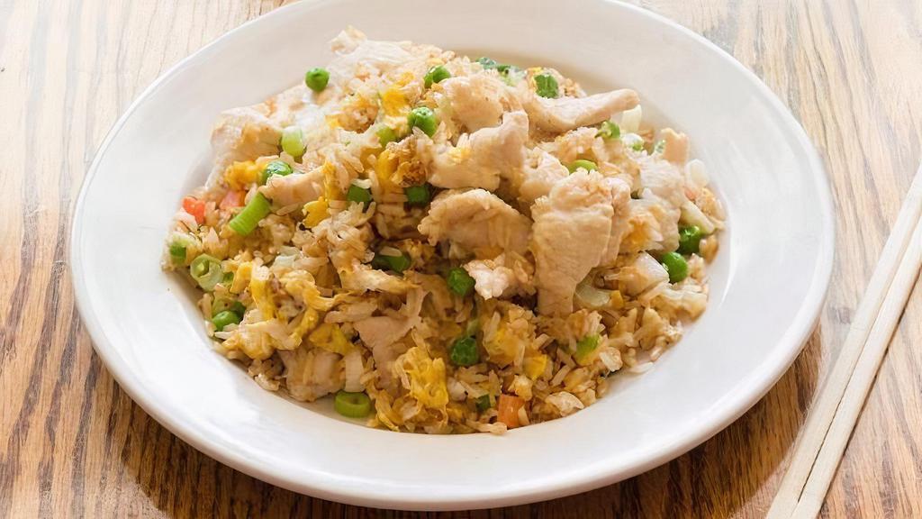 Chicken Fried Rice · Authentic fried rice cooked with egg, peas and carrots, green onions and chicken