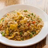 Egg Fried Rice · Authentic fried rice cooked with eggs, peas, carrots, and green onions.
