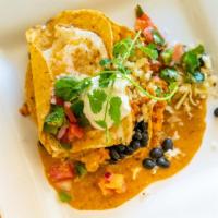 Huevos Rancheros · two eggs any style over house green chili, black beans, pico de gallo, pepper jack cheese, r...