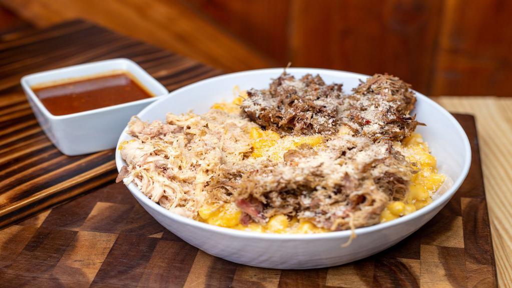 Big Meaty Bbq Mac & Cheese · Mac and cheese topped with pulled pork, brisket, shredded chicken, BBQ sauce and panko.