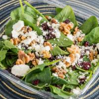 Raspberry Walnut Spinach Salad · Serves 2. Fresh baby spinach topped with walnuts, dried cranberries, and feta cheese with fa...