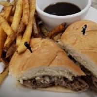 French Dip · Our home cooked signature roast beef, Swiss cheese, sautéed onions, garlic aioli and au jus.