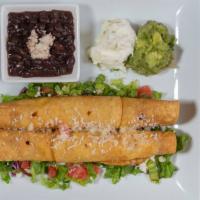 Flautas De Pollo (Order Of 2) · Flute shaped tacos filled with chicken marinated in chipotle, garlic oregano.