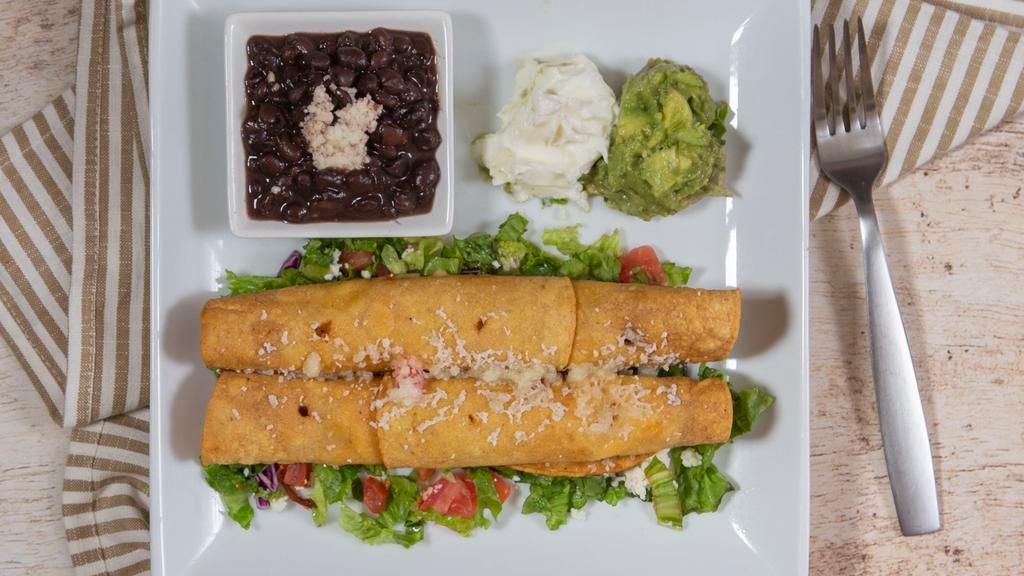 Flautas De Pollo (Order Of 2) · Flute shaped tacos filled with chicken marinated in chipotle, garlic oregano.