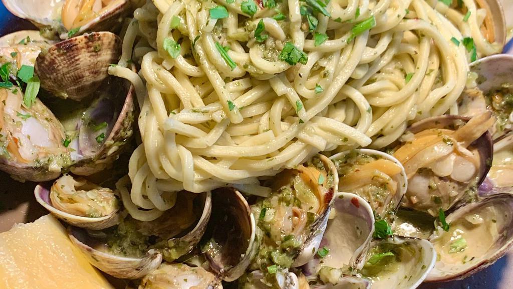 Pasta Con Vongole · Fresh manila clams sauteed with garlic parsley, white wine served with spaghetti.