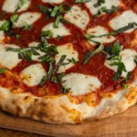 Margherita Pizza · Classic Italian simplicity: imported Italian tomatoes, fresh mozzarella, basil, extra virgin...