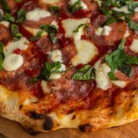 Soppressata Pizza · Northern Italian salami, locally made ricotta, mozzarella, tomato sauce, basil, Calabrian ch...