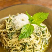 Spaghetti Con Pesto Genovese · Fresh egg spaghetti, fresh basil, pine nuts, garlic, extra virgin olive oil and aged Parmigi...