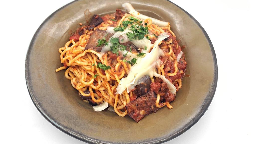 Spaghetti A Picchio Pachio · A traditional Sicilian eggplant pasta with fresh egg spaghetti, tomato sauce, chili pepper, toasted garlic. Vegetarian.