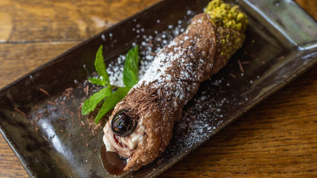 Cannoli Siciliani · House-made cannoli shell filled with locally made ricotta, semisweet chocolate, and garnished with Amarena cherries and pistachio.