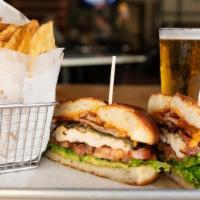 Chicken Sand · grilled chicken, provolone, roasted green chilis, smoked cascabel aioli, bacon, lettuce, tom...