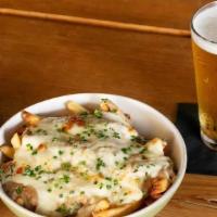 Poutine · house made gravy, white cheddar cheese curds, chives