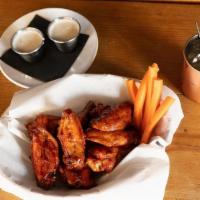 Wings · naturally raised, carrots. choice of ONE:  buffalo sauce, whiskey BBQ, sriracha honey sesame