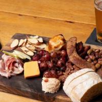 Combo Board · bacon confit, house-cured ham, fennel sausage, brie en croute, aged cheddar, tomato goat che...