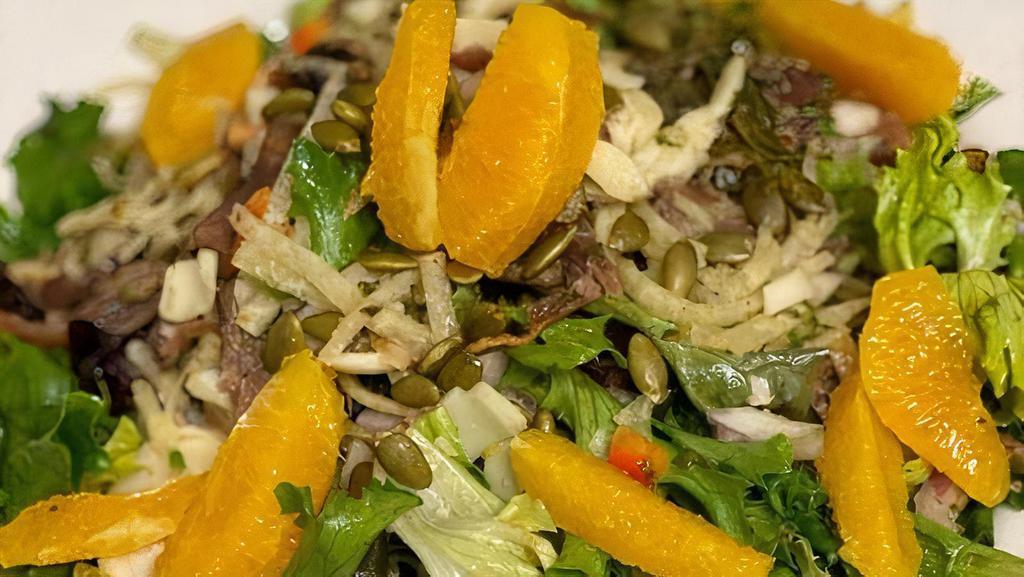 Citrus Salad · Field greens, Orange Supremes,  Red Onion, Hearts of palm, tossed in a chimichurri vinaigrette topped with Orange marinated Jicama.
