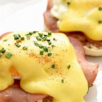 Traditional · Poached eggs over shaved ham on a English muffin topped with hollandaise sauce.