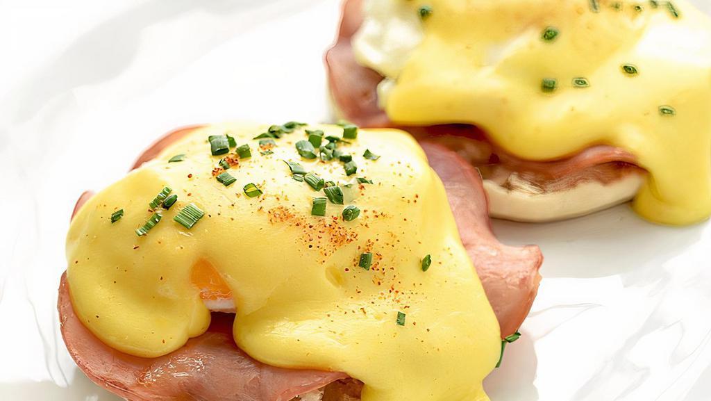Traditional · Poached eggs over shaved ham on a English muffin topped with hollandaise sauce.