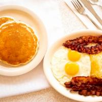 Hungry Man Breakfast · Choice of bacon, ham, sausage or black bean burger with two eggs any style & hash browns. Se...