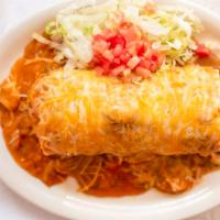 Breakfast Burrito · 2 eggs scrambled wrapped in a flour tortilla. Smothered in green chili & cheese, served with...
