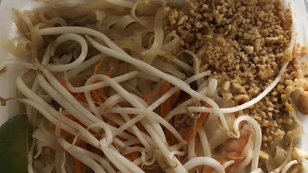 #44 Pad-Thai · Stir-fried medium flat rice noodle with sweet tamarind sauce, egg, green onion, bean sprouts, carrot, and crush peanuts.