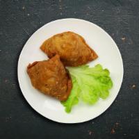 The Love Triangle (Samosa) · Triangle shaped deep fried pastry dumplings filled with spiced potatoes and vegetables