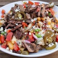 Carne Asada Nachos Or Fries · Grilled steak, choice of tortilla chips or fries, melted poblano cheese sauce, pico de gallo