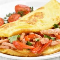 Chorizo Omelette · Homemade chorizo mixed with three eggs. Topped with our homemade special sauce. Served with ...