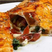 Delite Calzone · Chicken , smoked ham, onions, green peppers.