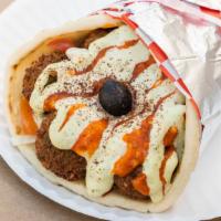 Falafel Veg · Vegan falafel, tomatoes, onions, lettuce, dairy free garlic sauce, hot sauce. topped with an...