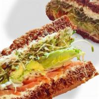 Sacks Mona Sandwich · Nova lox, avocado, lemon cream cheese with capers, sprouts, and red onion, on pumpernickel b...