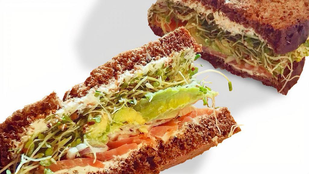 Sacks Mona Sandwich · Nova lox, avocado, lemon cream cheese with capers, sprouts, and red onion, on pumpernickel bread.