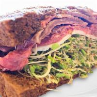 Sacks Van Gogh Sandwich · Rare roast beef, fresh dill, Havarti cheese, sprouts, and sacks special deli mustard, on pum...