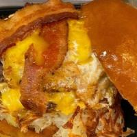 The Hung Over Burger · Half pound burger, Hash browns, American cheese, Bacon, Over Medium egg, Mayo on a toasted B...