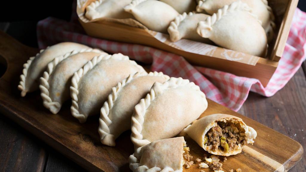 Beef Traditional Argentinian Empanadas (6 U Ready To Bake - Fry) · Argentinian Traditional BEEF Empanadas.  Ingredients: Ground Beef,  Red bell pepper,  Green bell pepper,  boiled eggs,  green onion,  herbs. Frozen Argentinian  Beef Empanadas. To bake or Fry No preservatives. 6 Units