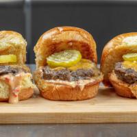 Bison Sliders · rock river ranch bison, melted cheddar, bacon onion jam, house spicy bread and butter pickle...