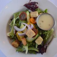 Side Garden Salad · Mixed greens, tomatoes, cucumber, red onion, croutons, and champagne vinaigrette