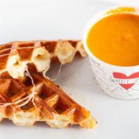 Grilled Cheese And Tomato Bisque · Croissant waffle sandwich with muenster, provolone, garlic butter and house made tomato bisq...