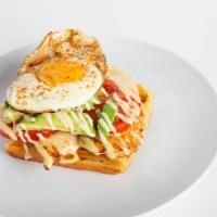 Chicken Avocado Tartine · Grilled chicken, provolone, tomato, avocado & a sunny side up egg on a croissant waffle.