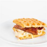 Breakfast Sammy · Croissant waffle sandwich with bacon, eggs, cheese & special sauce.