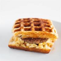 Sausage Sammy · Croissant waffle sandwich with sausage, soft scrambled eggs, provolone cheese & maple syrup.